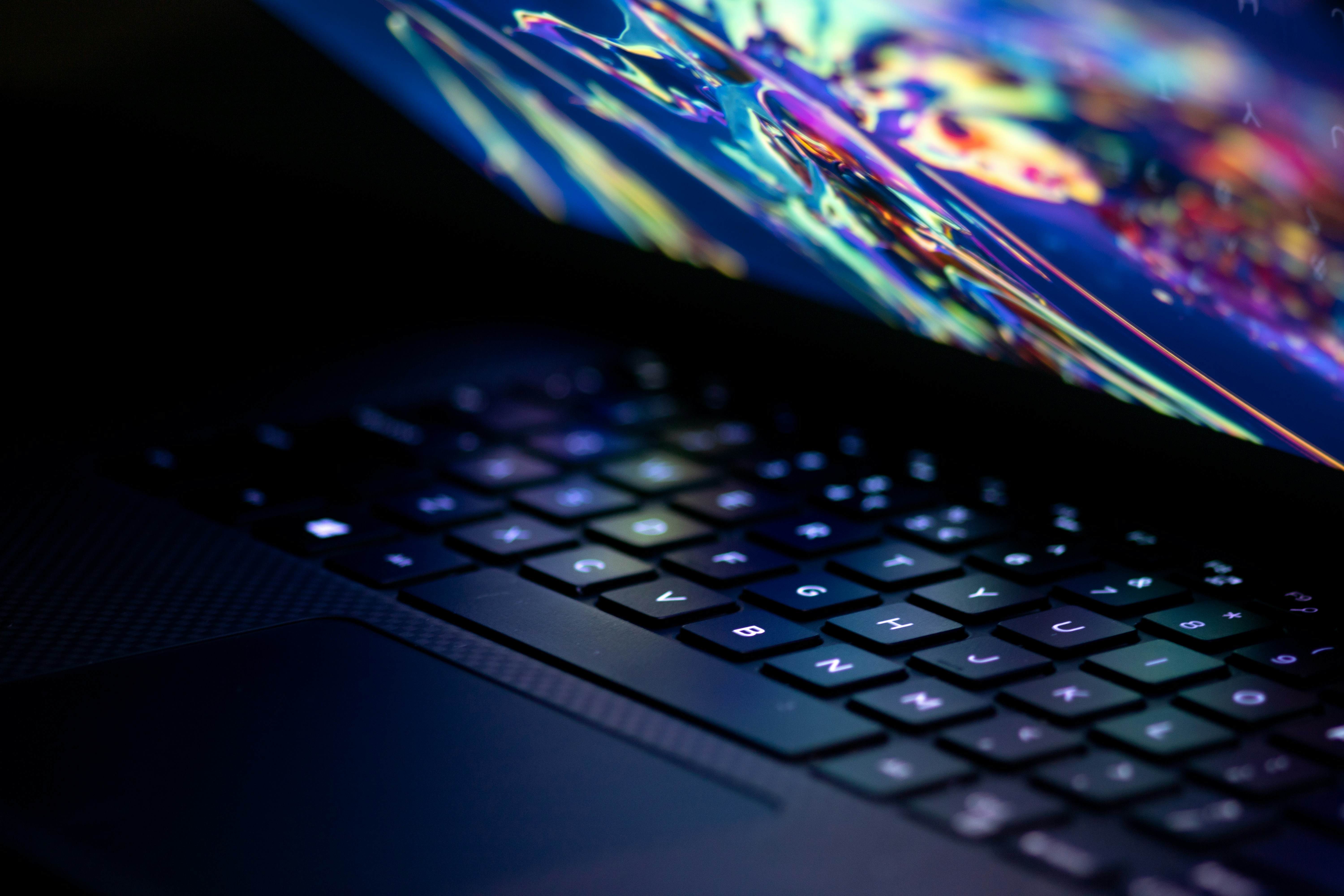 Part open laptop with coloured screen